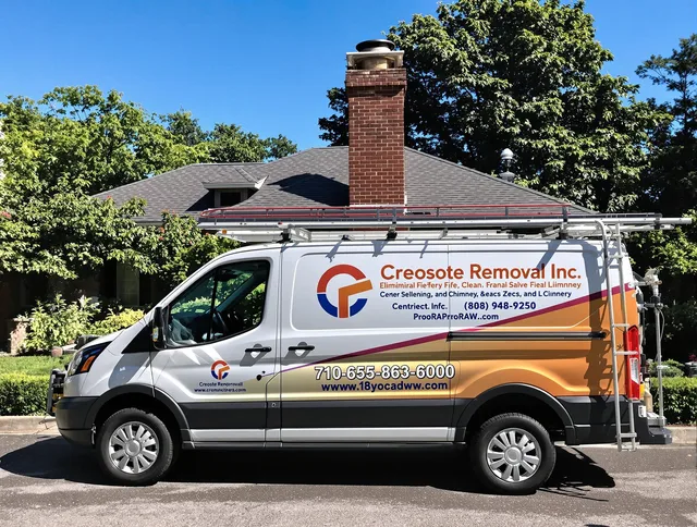 Ashland Chimney Sweep technician removing creosote safely in Ashland, MA
